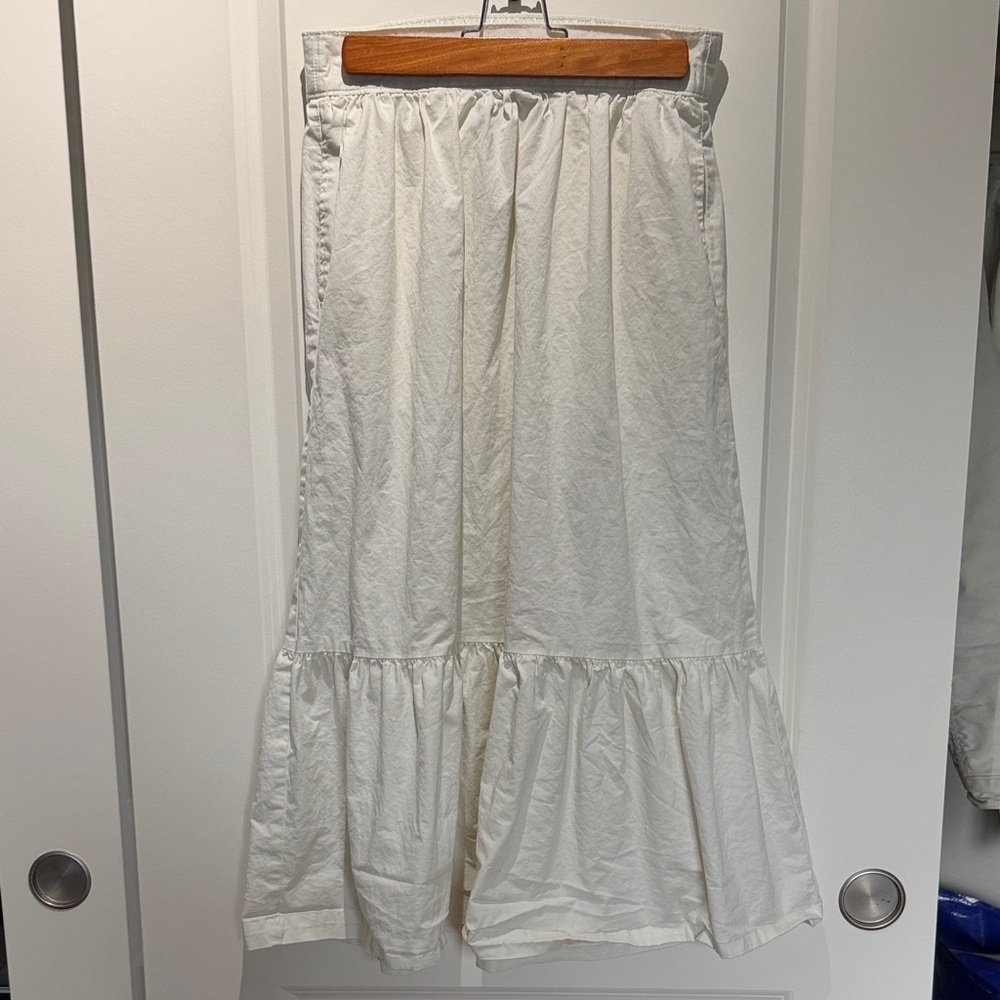 White peplum midi skirt with pockets
